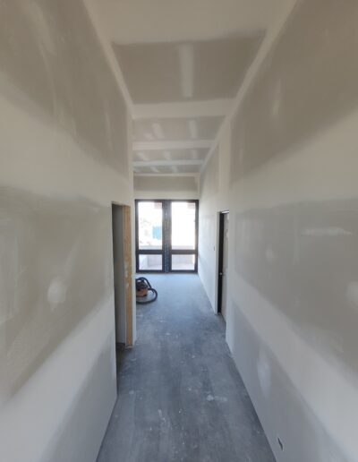 Perfectly done Drywall Installation In Hallway. Drywall and taping in a new house.