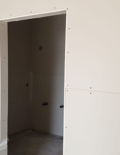 Drywall Installation Perfectly done around doors. Drywall and taping in a new house.