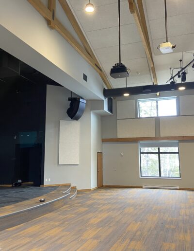 Stage room for performances. Large vaulted ceilings with acoustic paneling for sound absorption